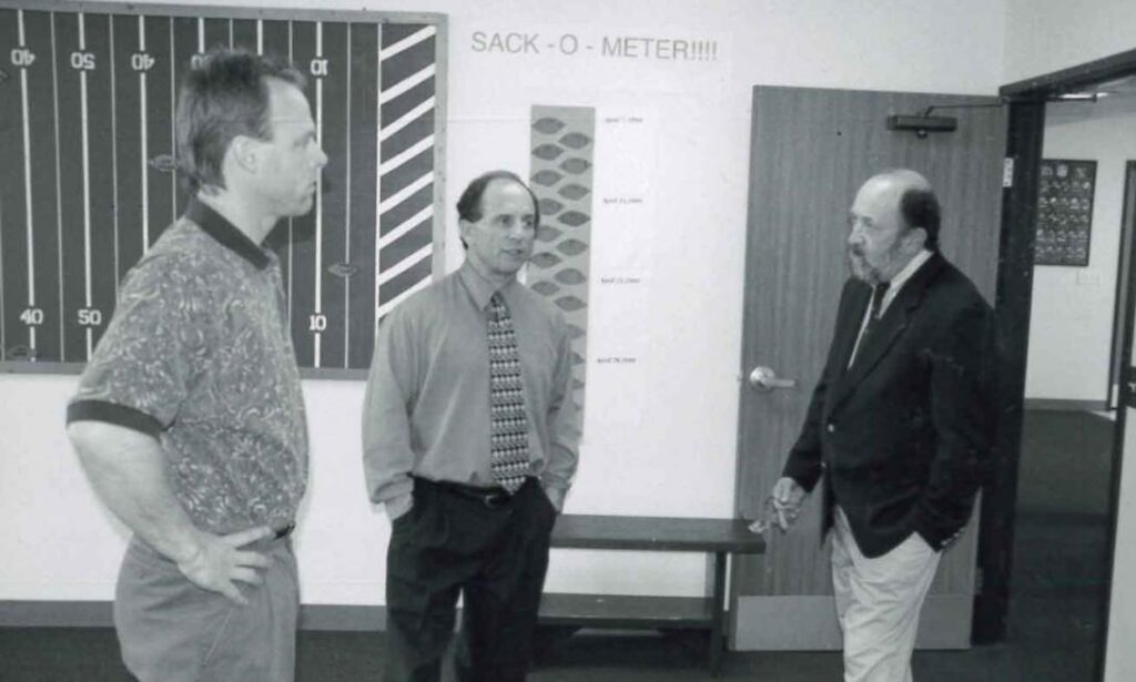 Nexus staff talking with MN Senator Paul Wellstone.