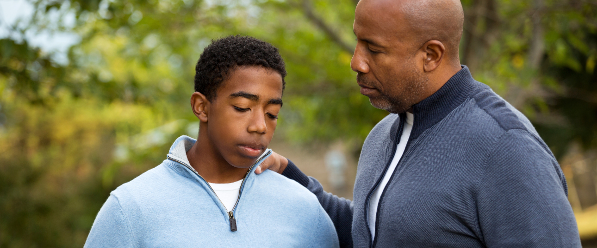 father and son having a serious discussion